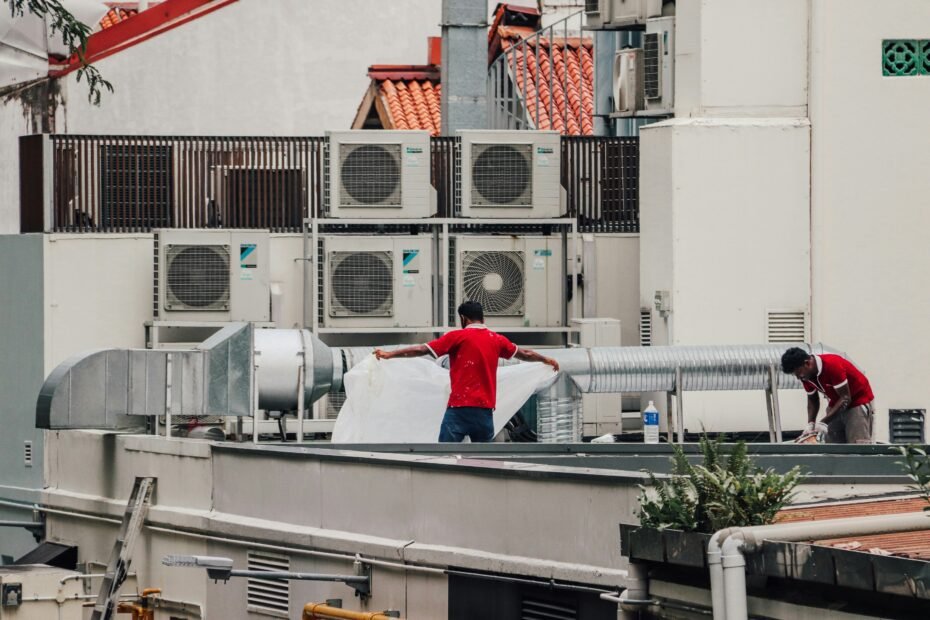 HVAC technician inspecting an air conditioner to determine repair or replacement